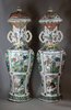 Y906 A pair of large famille verte lobed baluster vases and covers